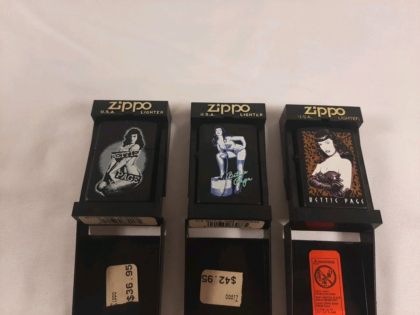 Set Of 3 Betty Page Zippo Lighters Never used