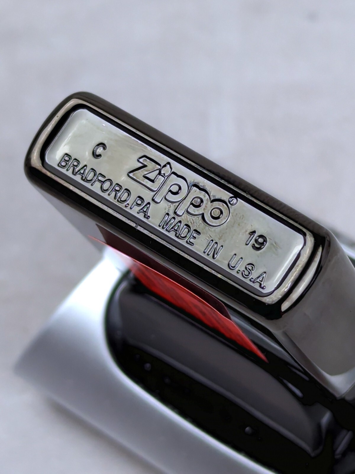 Zippo 49117 SPLIT FACE DESIGN on High Polish Black Windproof Lighter MARCH 2019