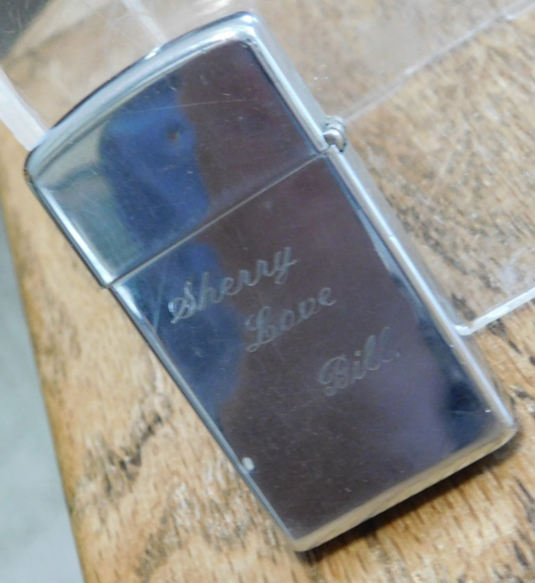 1965 Slim Zippo Cigarette Lighter, with Sales Box. Nice. BUY IT NOW.