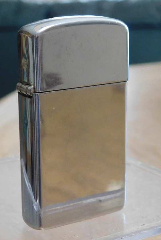 1965 Slim Zippo Cigarette Lighter, with Sales Box. Nice. BUY IT NOW.