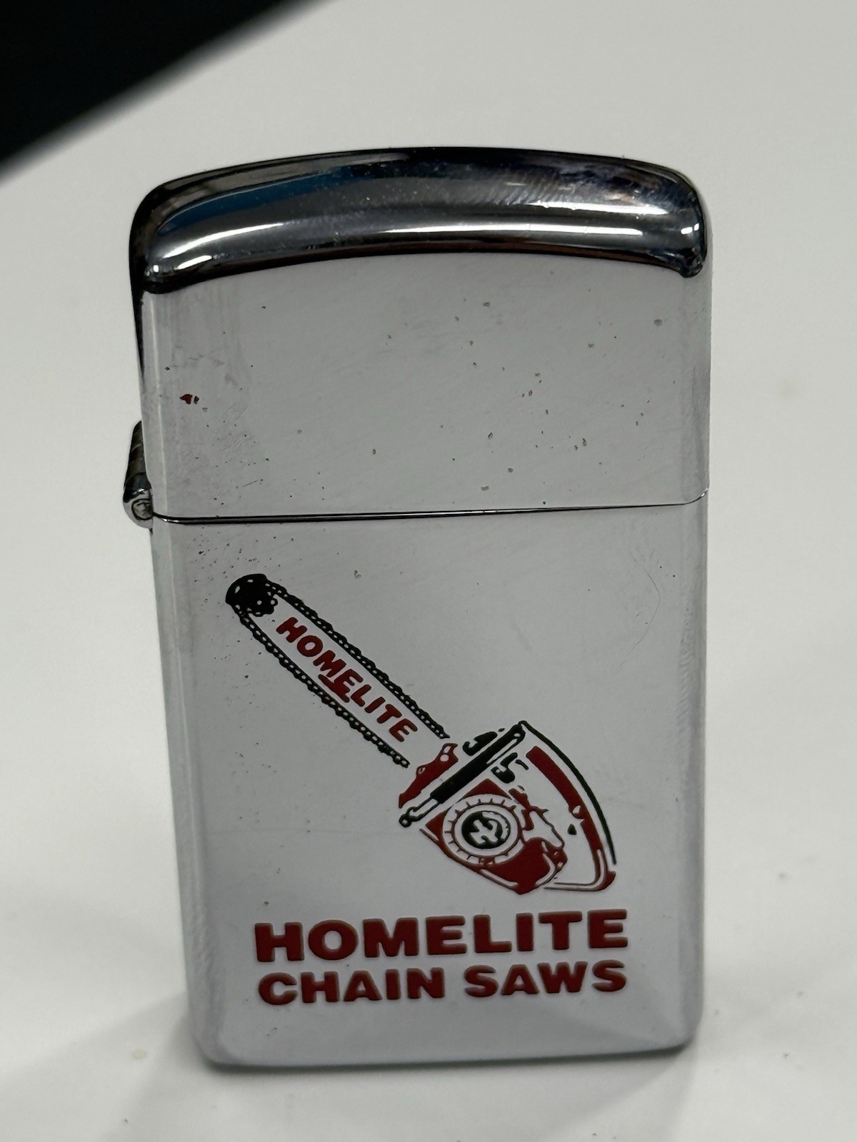 ZIPPO 1978 HOMELITE CHAIN SAWS ADVERTISING SLIM LIGHTER U197