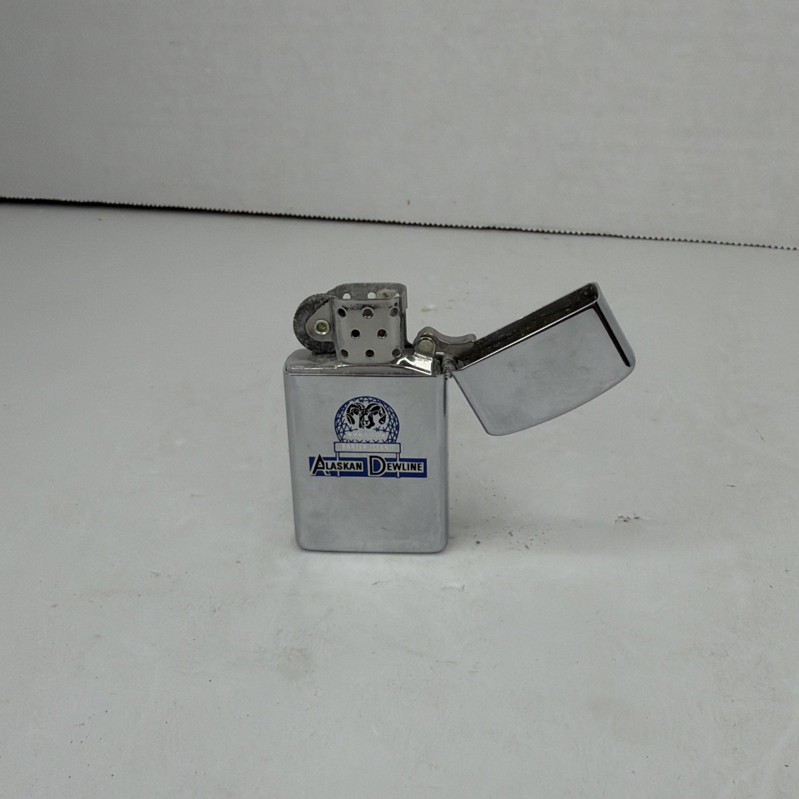 Vintage Zippo Slim Lighter Alaskan Dewline Made in USA Advertising Collectible