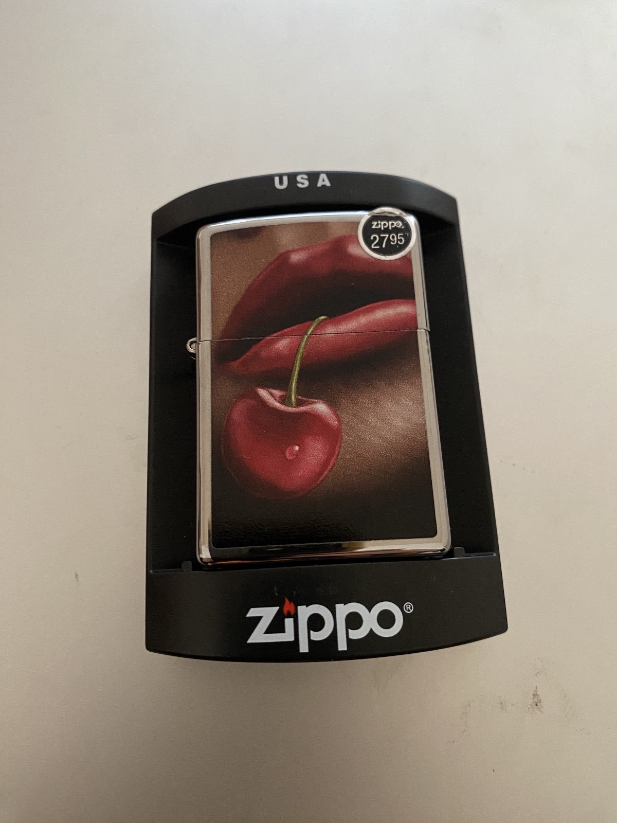 Lips and Cherry Zippo Lighter 28655 nib sealed with orange sticker. Super cool!.