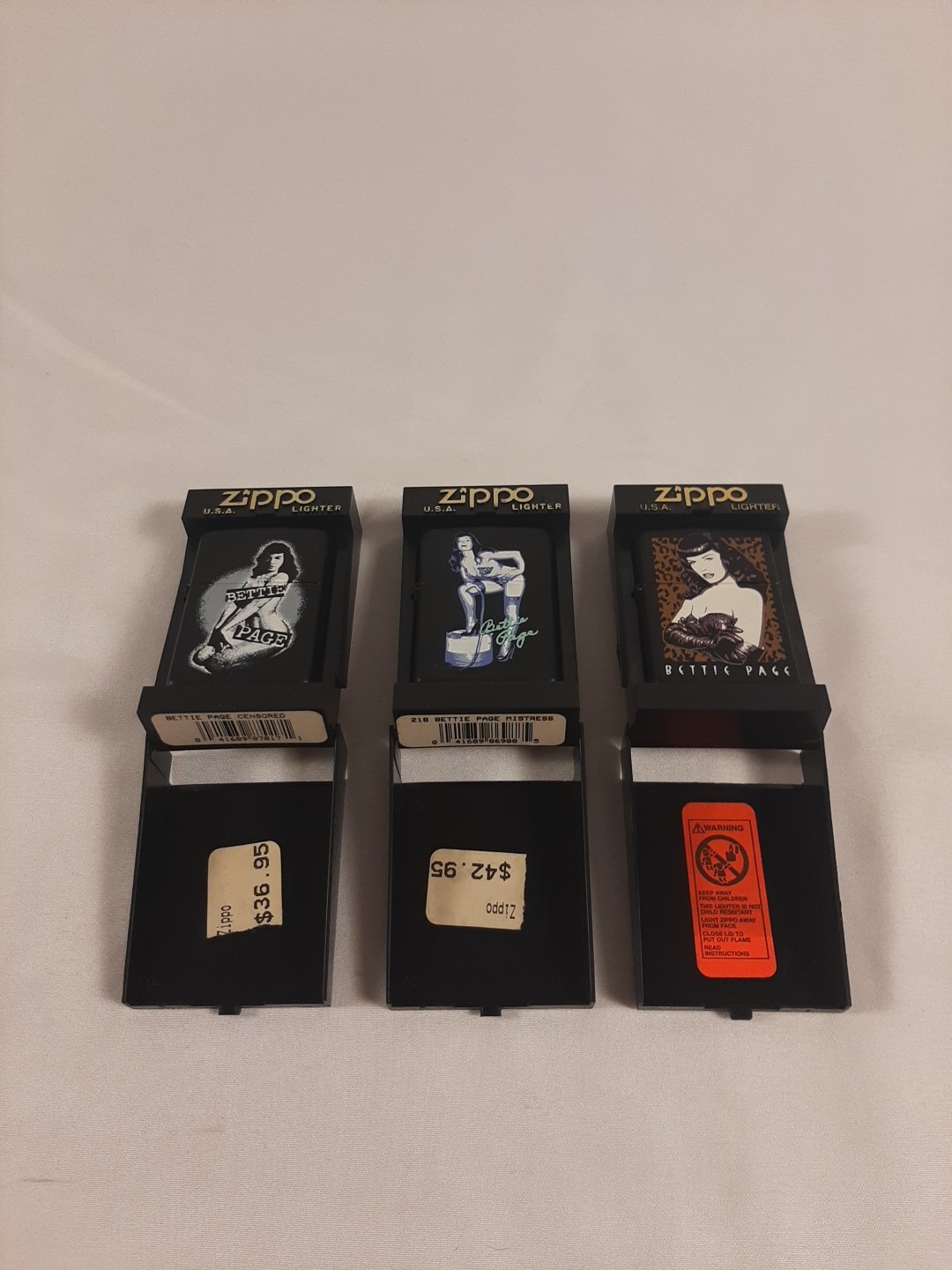 Set Of 3 Betty Page Zippo Lighters Never used