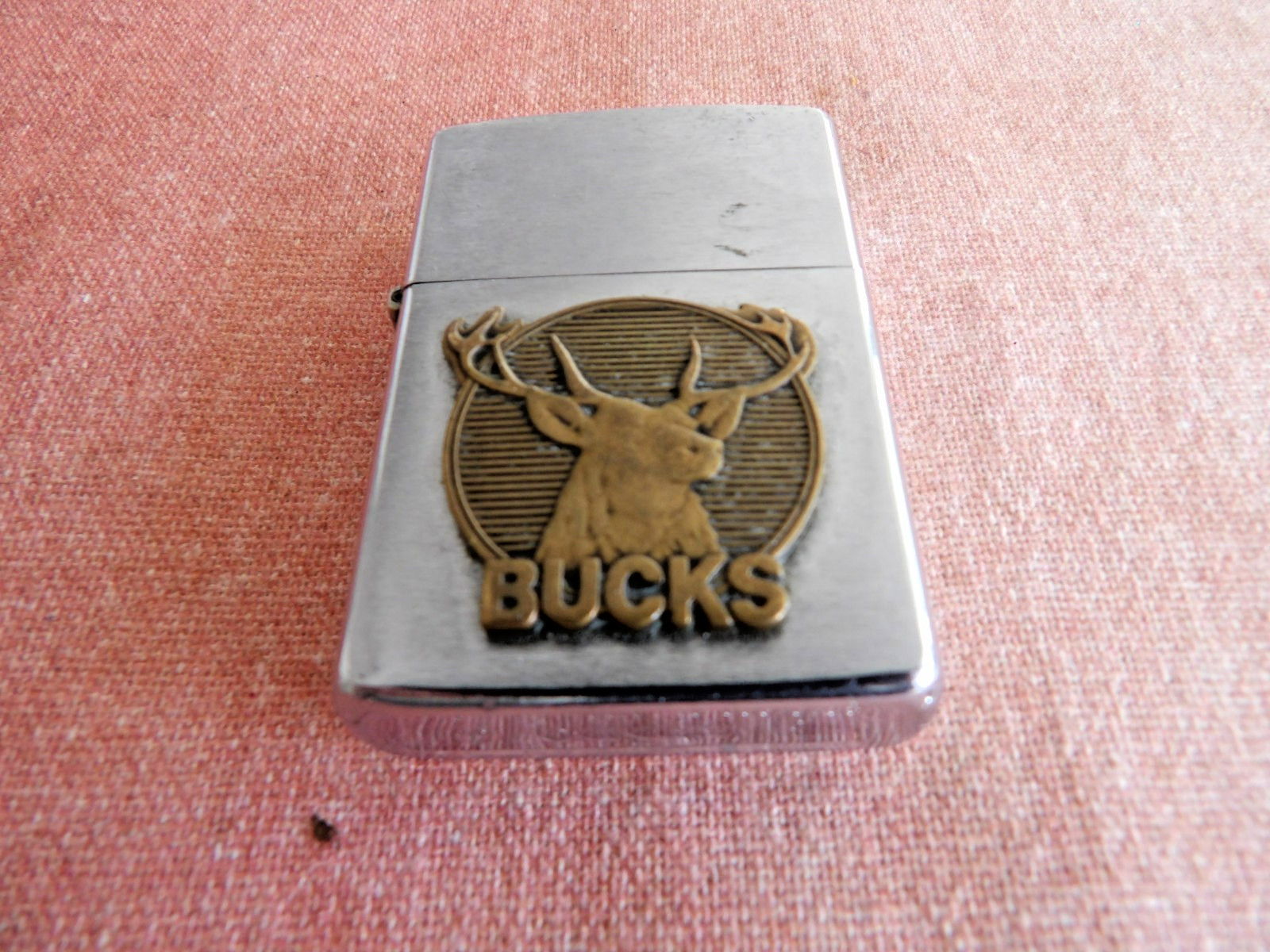 Zippo Cigarette Lighter with a Bucks Medallion Silver Color Good Wick has Flint