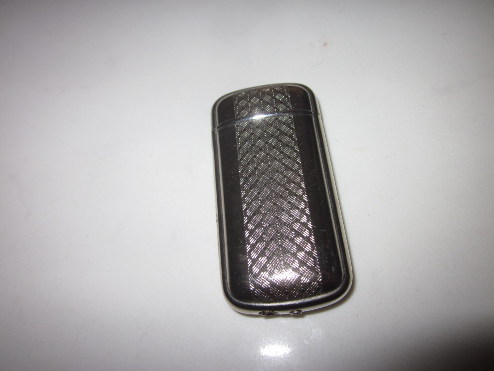 Vintage Silver-Tone Collectible Lighter with Textured Pattern