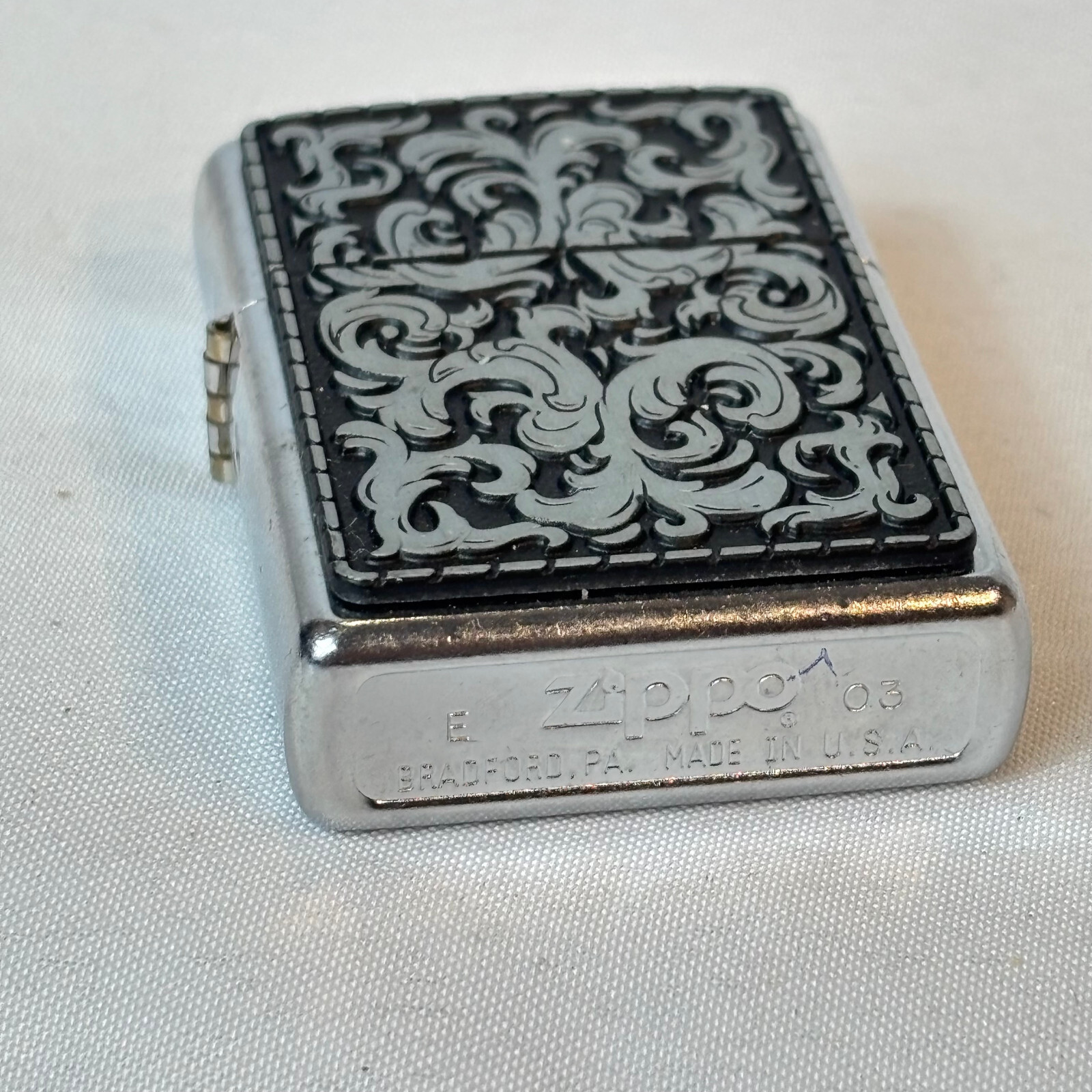 2003 Zippo Lighter Storming Scroll Sticker Sealed in Box