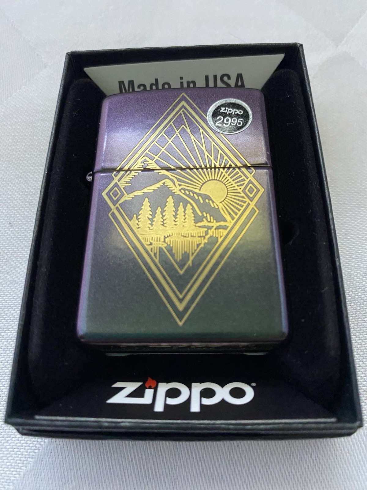 Zippo Etched Outdoor Design On An Iridescent Lighter