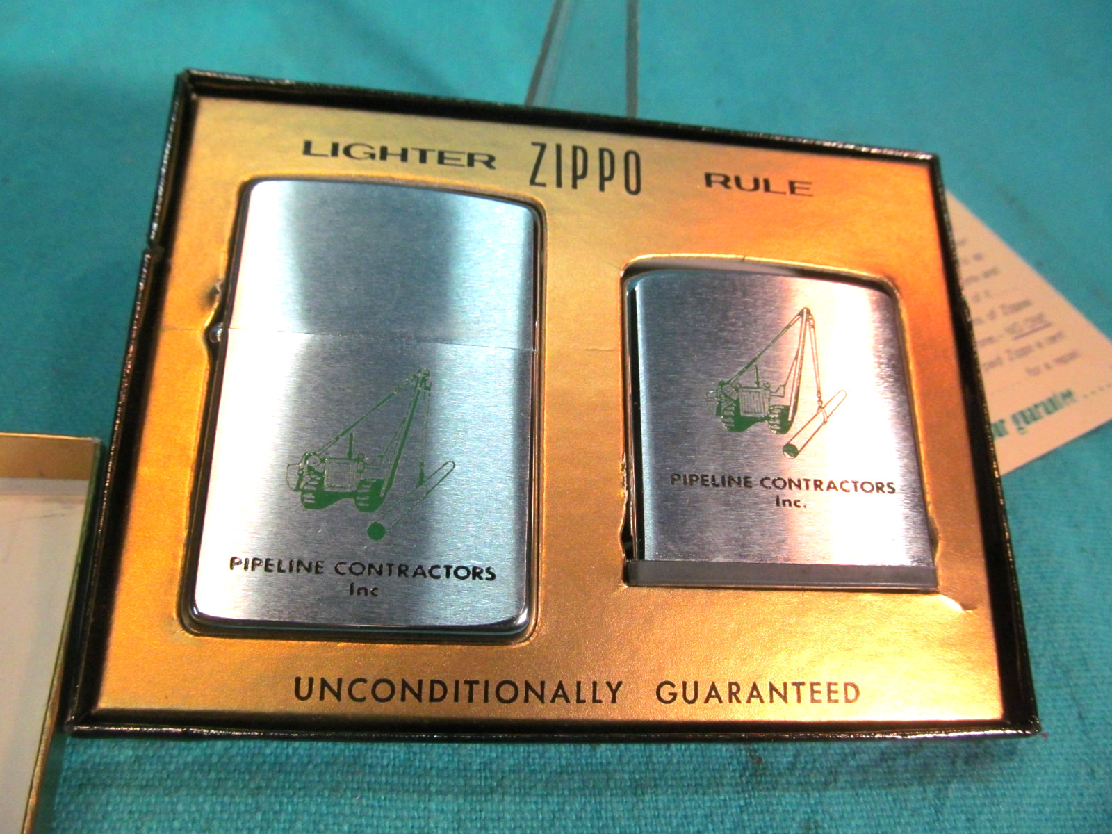 NOS 1950-1957 ZIPPO ADVERTISING LIGHTER & RULE IN BOX PIPELINE CONTRACTORS INC