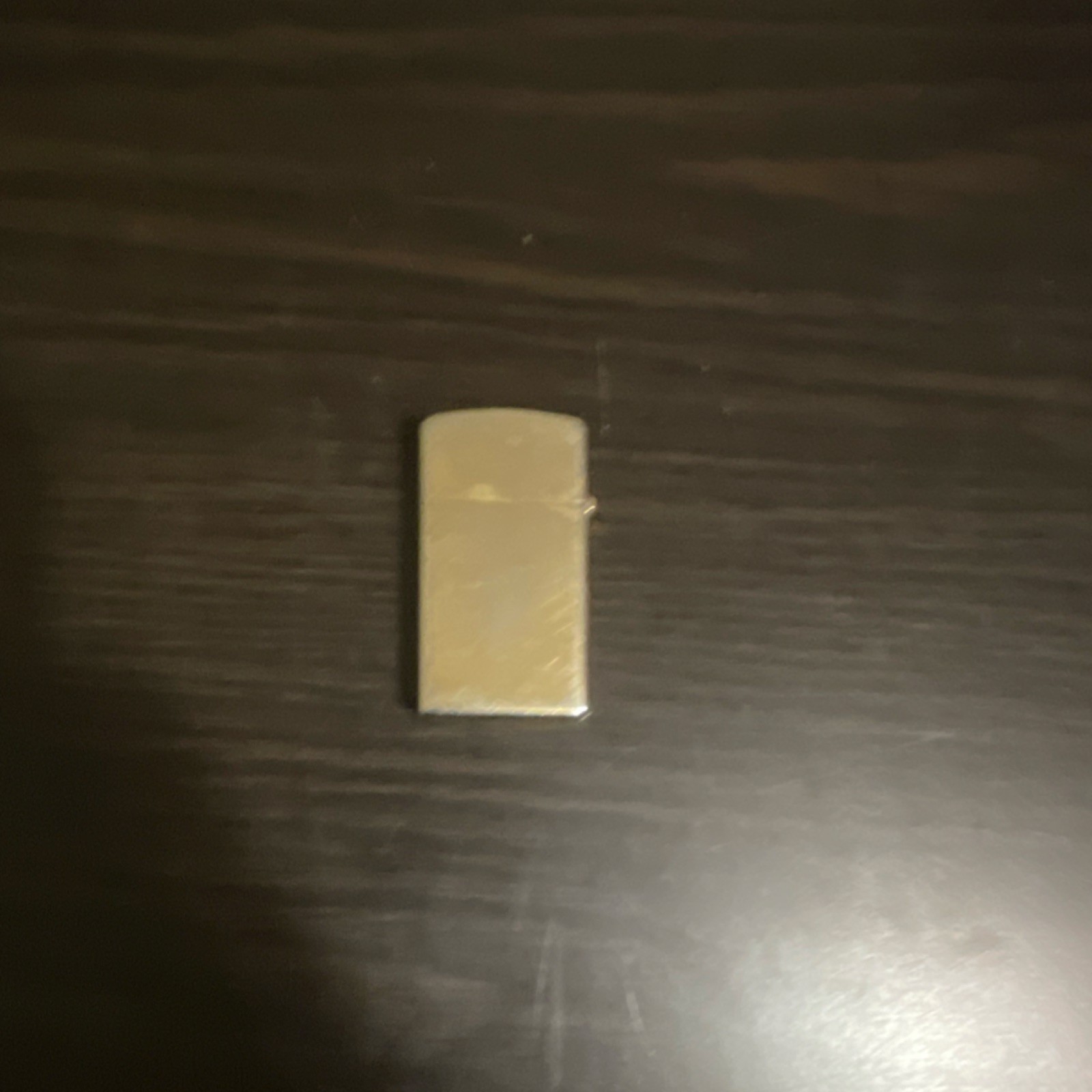 Zippo Gold-Tone Collectible Lighter with Diagonal Stripe Pattern Design