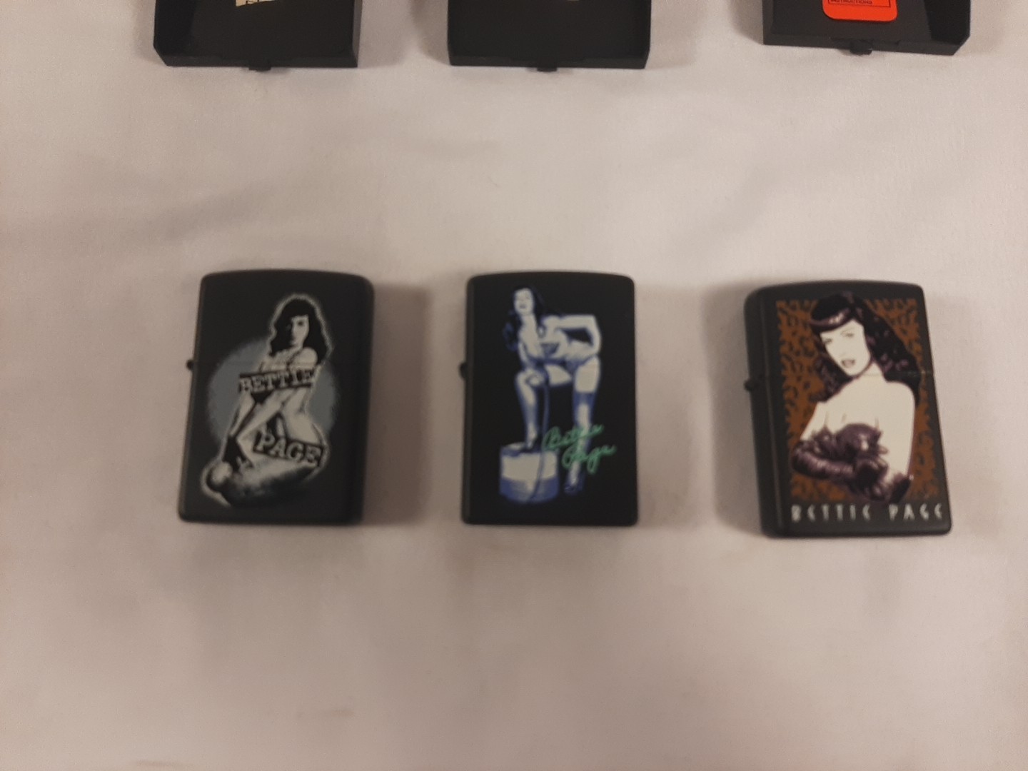 Set Of 3 Betty Page Zippo Lighters Never used