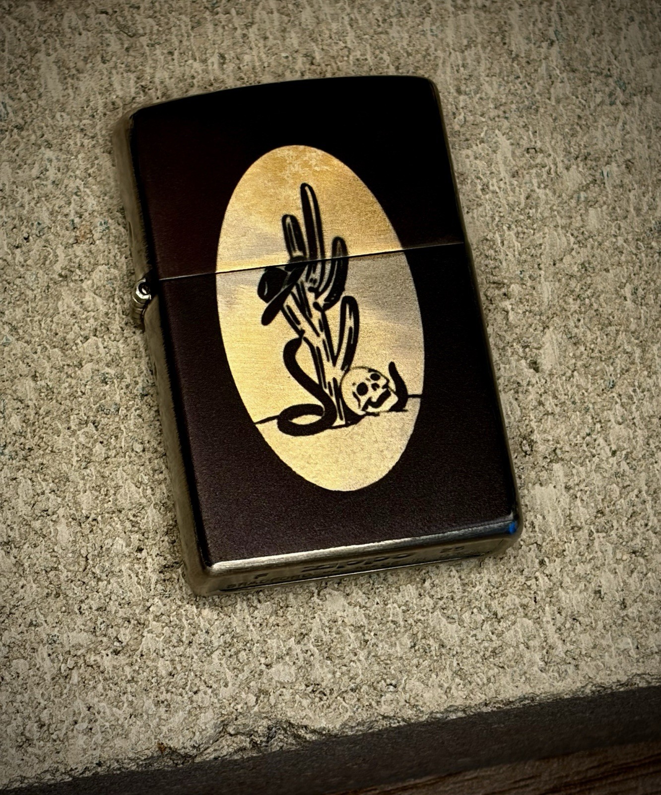 Distressed Silver And Gold Western Skull And Cactus Zippo Lighter.